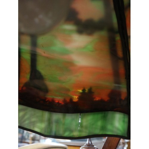 551 - Floor lamp by Handel with pine woods sunset shade, patinated bronze and painted slag glass shade wit... 
