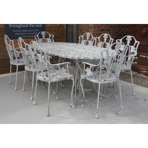 569 - Large Cast Metal Garden Dining Set &ndash; Ornate vintage cast metal table with eight chairs. Table ...