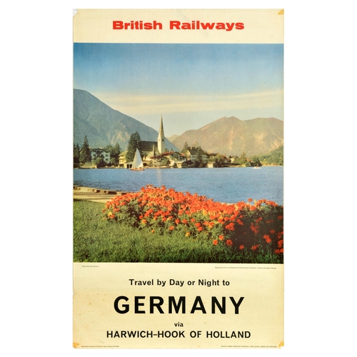 Travel Poster British Railways Germany Tegernsee Munich. Original vintage travel poster - Travel by Day or Night to Germany via Harwich-Hook of Holland - featuring an image of a church at the Tegernsee lake and the Bavarian Alps in the background. Published by British Railways Eastern Region. Printed in Great Britain by Waterlow & Sons, London and Dunstable. Fair condition, tears, creasing, paper losses on edges, staining, tape marks, foxing. Country of issue: UK, designer: Unknown, size (cm): 101x63, year of printing: 1960s.