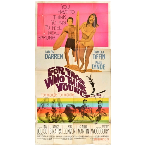 Movie Poster For Those Who Think Young Surfing Rainbow. Original vintage three sheet movie poster for a college surfing film, For Those Who Think Young, starring James Darren, Pamela Tiffin, Paul Lynde, Tina Louise, Nancy Sinatra, Bob Denver, Claudia Martin and Woody Woodbury. Fun and colourful image featuring college students surfing and dancing with the tagline - You have to think young to feel real sprung! Large size. Fair condition, folds, creasing, tears, staining, paper losses, browning. Country of issue: USA, designer: unknown, size (cm): 133x104, year of printing: 1964.