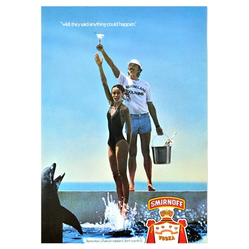 Advertising Poster Set Smirnoff Vodka Alcohol Cocktail. Set of 5 original vintage drink handbill small advertising posters for Smirnoff, the renowned vodka brand founded in Moscow.  1. It was tea for two until we discovered Smirnoff. The photograph features a couple in elegant clothing with the Smirnoff logo below. These original vintage Smirnoff advertising posters are part of the 1970s The Effect is Shattering campaign by the London-based Young and Rubican agency, which aimed to promote the vodka as a way to achieve glamour and excitement as an escape from the humdrum of daily life. Good condition, creasing, small tears, minor staining. Country of issue: UK, designer: Unknown, size (cm): 32x25, year of printing: 1970s; 2. I've spread my wings since I discovered Smirnoff. The photograph features a pilot resting against a vintage open top biplane, and wearing a leather wool lined brown leather bomber jacket, jeans and bandit aviator goggles.  Good condition, creasing, tears, staining. Country of issue: UK, designer: Unknown, size (cm): 32x24, year of printing: 1970s; 3. I used to take the caravan to Southend until I discovered Smirnoff. The effect is shattering. The set of photograph shows a man on a camel in the desert and shots of a drink being poured in the glass over ice and lemon. Good condition, creasing, crease marks. Country of issue: UK, designer: Unknown, size (cm): 30.5x25, year of printing: 1970s; 4. Well, they said anything could happen. Remember, whatever happens, don't overdo it. The photograph features an image of a Marineland dolphinarium keeper holding a bucket with Smirnoff vodka, seen raising a cocktail above the pool and a lady jumping out of the water to get the cocktail, with a dolphin and Smirnoff logo in the foreground. Very good condition, minor staining. Country of issue: UK, designer: Unknown, size (cm): 30x21, year of printing: 1970s; 5. Well, they said anything could happen. The photograph features an elegantly dressed couple with cocktails laughing and smiling with watermelons, lemons, oranges, strawberries, plums and cherries falling out of the slot machines. Excellent condition. Country of issue: UK, designer: Unknown, size (cm): 30x21, year of printing: 1970s.