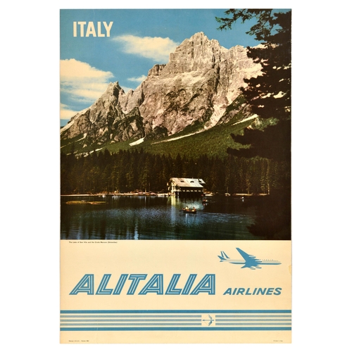 Travel Poster Italy Alitalia San Vito Lake Croda Marcora Dolomites. Original vintage travel advertising poster for Italy by Alitalia, featuring a photograph of boats on the San Vito lake and Croda Marcora Dolomite mountains towering above, airline name in light blue with a plane above and striped pattern below the text. Alitalia was Italy's national airline and flag carrier from 1946 until it was privatised in 2009.  Good condition, creasing, tears, staining. Country of issue: Italy, designer: Unknown, size (cm): 98x68, year of printing: 1963.