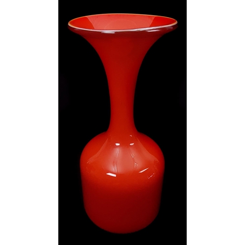 21 - An orange glass bottle vase, with flared trumpet rim, in the style of Per Lutken, 28cm approx. high