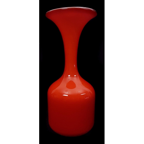 21 - An orange glass bottle vase, with flared trumpet rim, in the style of Per Lutken, 28cm approx. high