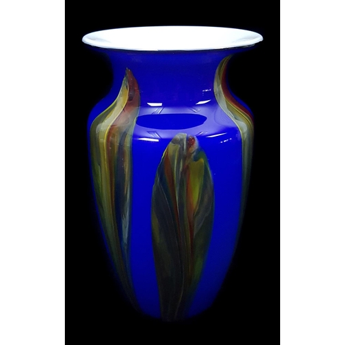 22 - A glass baluster vase, white cased in blue with tortoiseshell coloured stripes, probably Murano glas... 