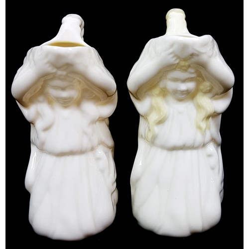 3 - Belleek porcelain - Two Undine shape cream jugs, modelled as a kneeling child, one with yellow nacre... 