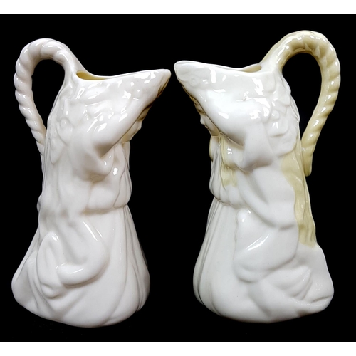 3 - Belleek porcelain - Two Undine shape cream jugs, modelled as a kneeling child, one with yellow nacre... 