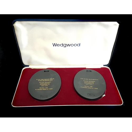 157 - A pair of Wedgwood black basalt commemorative medallions, oval, for the Royal Silver Wedding 1972, m... 