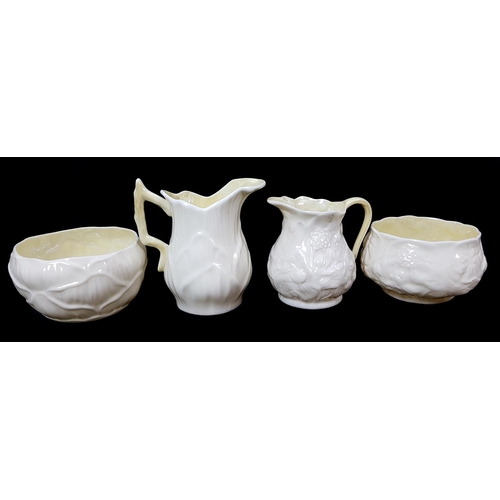 5 - Belleek porcelain - Two cream jug and sugar bowl sets, yellow tint, lotus shape; and lily shapes, 2n... 