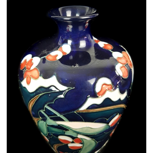 30 - Moorcroft Pottery - A Trial vase, Holly, Ivy and Mistletoe pattern on dark blue ground, marked Trial... 