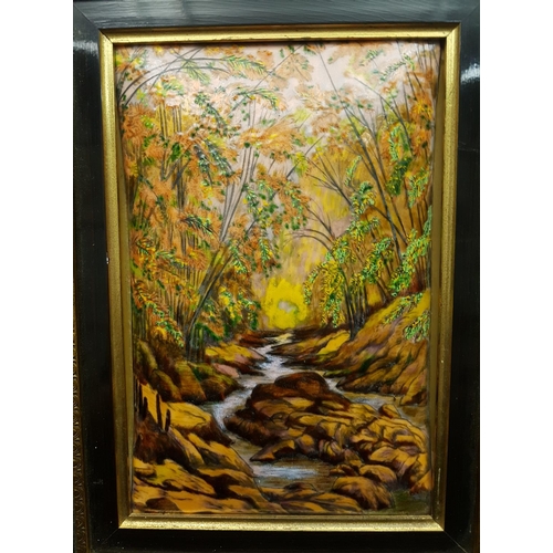 15 - A Limoges enamel plaque, decorated with a autumnal wooded stream, framed, 48 x 38.5cm max including ... 