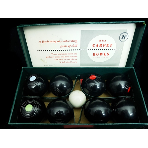 198 - A set of indoor carpet bowls, manufactured by Brookes & Adams Limited, boxed