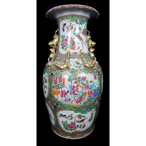 116 - A Chinese famille rose enamelled baluster vase, well painted with scattered reserves of figures in i... 