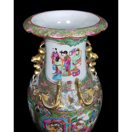 116 - A Chinese famille rose enamelled baluster vase, well painted with scattered reserves of figures in i... 