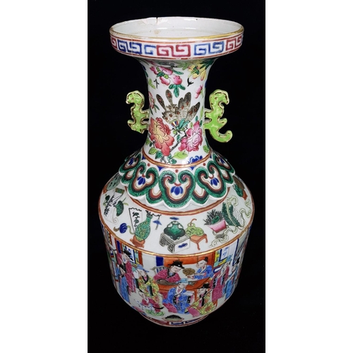 119 - An unusual Chinese famille rose bottle form vase, the trumpet neck with pierced scroll handles and a... 