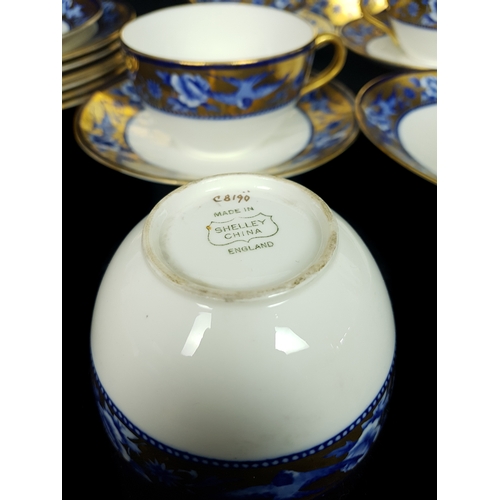 91 - Shelley China - A part tea service of Blue Swallows pattern, Number C 8190, comprising: four cups, f... 