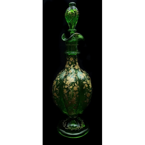 191 - Moser - An emerald green gourd form decanter and stopper, gilded with detailed prunus blossom; and t... 