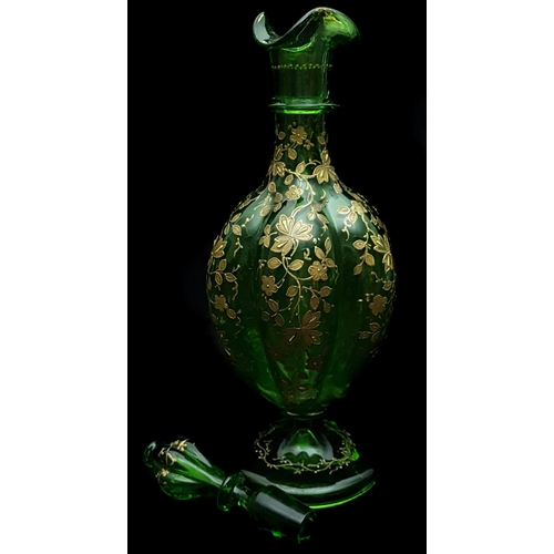 191 - Moser - An emerald green gourd form decanter and stopper, gilded with detailed prunus blossom; and t... 