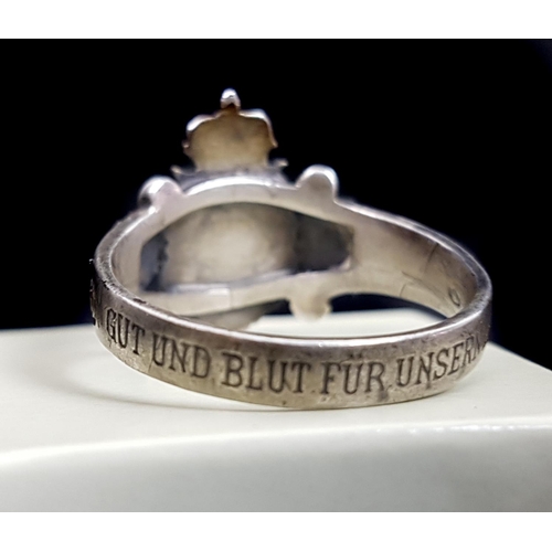 202 - A white metal Austrian Empire Kaiser shield ring, the shank inscribed GUT UND BLUT FUR UNSERN KAISER... 