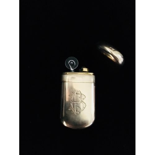 3 - A 9ct gold cigarette lighter of rounded rectangular form, engraved with PB monogramme to one side, m... 