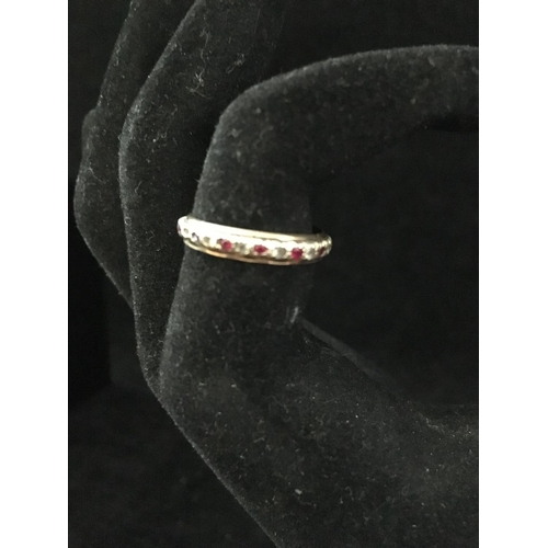 6 - A diamond and ruby full eternity ring, set in yellow and white metal, unmarked; a diamond chip illus... 