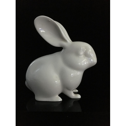 44 - Jeanne Grut for Royal Copenhagen - A porcelain figure of a rabbit, with blue eyes, shape number 4705... 