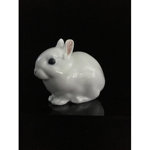 44 - Jeanne Grut for Royal Copenhagen - A porcelain figure of a rabbit, with blue eyes, shape number 4705... 