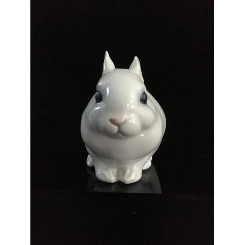 44 - Jeanne Grut for Royal Copenhagen - A porcelain figure of a rabbit, with blue eyes, shape number 4705... 