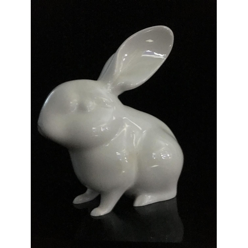 44 - Jeanne Grut for Royal Copenhagen - A porcelain figure of a rabbit, with blue eyes, shape number 4705... 