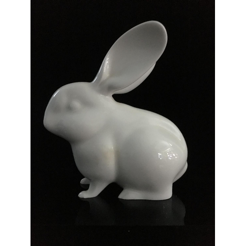 44 - Jeanne Grut for Royal Copenhagen - A porcelain figure of a rabbit, with blue eyes, shape number 4705... 