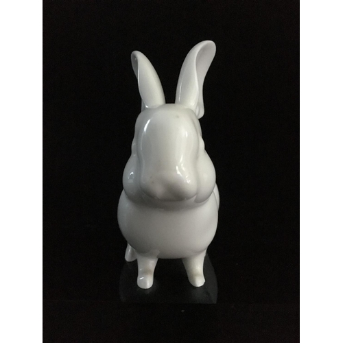 44 - Jeanne Grut for Royal Copenhagen - A porcelain figure of a rabbit, with blue eyes, shape number 4705... 