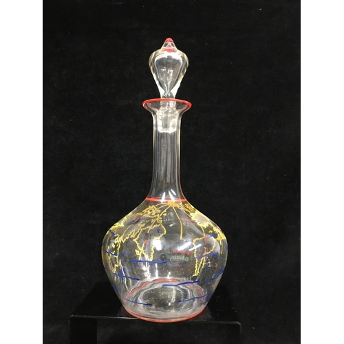 66 - A novelty decanter and stopper, the bottle form body enamelled with countries of the world with figu... 