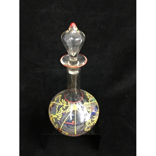 66 - A novelty decanter and stopper, the bottle form body enamelled with countries of the world with figu... 