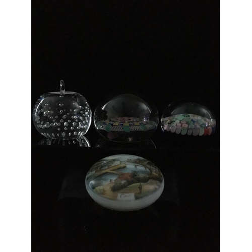 77 - Four glass paperweights - comprising Paul Ysart millefiore glass paperweight; a Strathern paperweigh... 