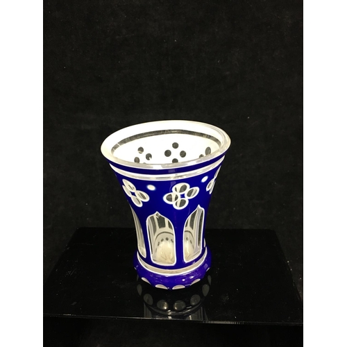 79 - A Bohemian cased glass spa beaker, blue and white overlay cut through to colourless with quatrefoil ... 