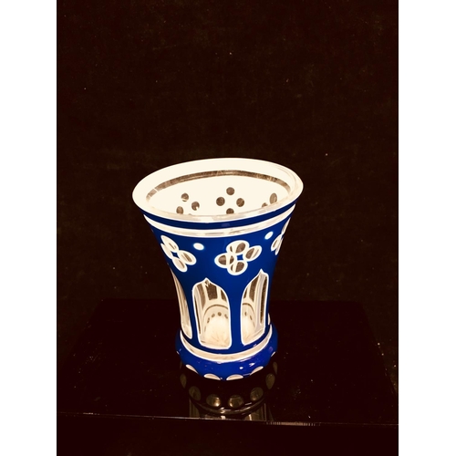 79 - A Bohemian cased glass spa beaker, blue and white overlay cut through to colourless with quatrefoil ... 