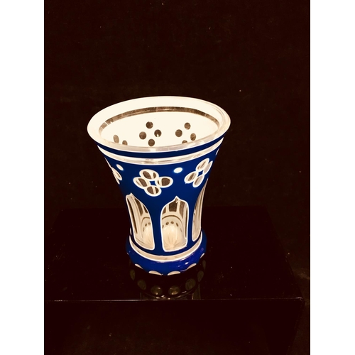 79 - A Bohemian cased glass spa beaker, blue and white overlay cut through to colourless with quatrefoil ... 