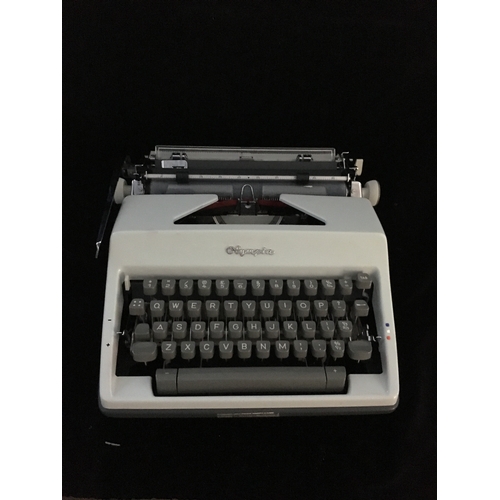 87 - An Olympia SM 9 portable typewriter, in hard case, script type, segment shift and full tabulation, c... 