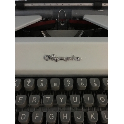 87 - An Olympia SM 9 portable typewriter, in hard case, script type, segment shift and full tabulation, c... 