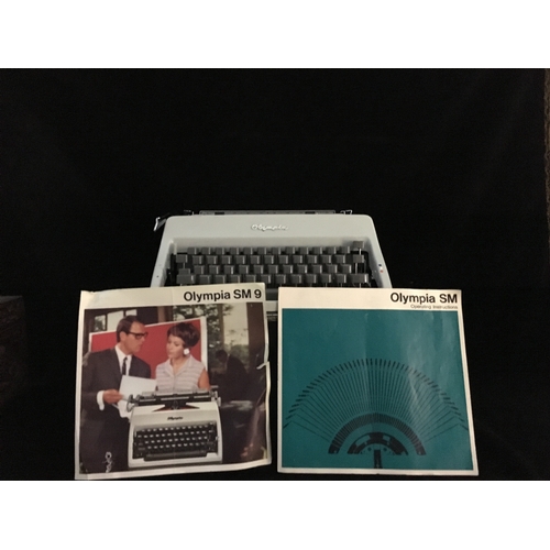 87 - An Olympia SM 9 portable typewriter, in hard case, script type, segment shift and full tabulation, c... 