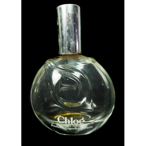 93 - Chloe -  Karl Largerfeld - A small colourless glass bottle of flattened globular form with frosted d... 