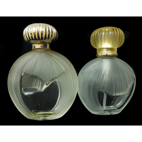 94 - Nina - Nina Ricci - Two Commercial perfume bottles, of flattened globular form partially moulded wit... 