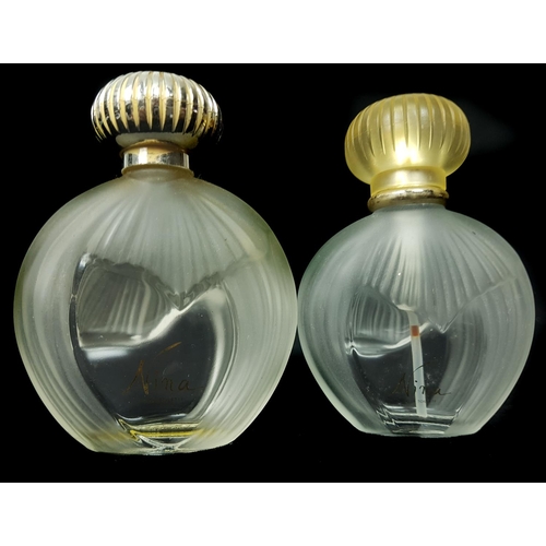 94 - Nina - Nina Ricci - Two Commercial perfume bottles, of flattened globular form partially moulded wit... 