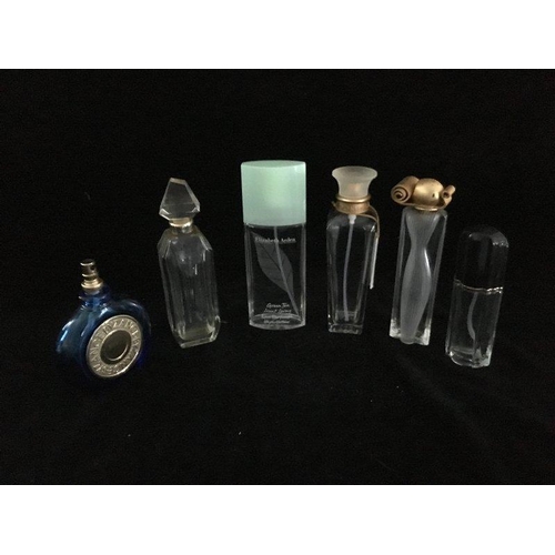 101 - A group of six commercial perfume bottles, comprising: Je Reviens - Worth, bombe section colourless ... 