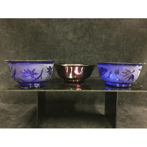 115 - Three Chinese Peking glass rice bowls, comprising a pair of cobalt blue colour etched with lotus flo... 