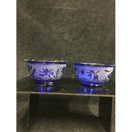 115 - Three Chinese Peking glass rice bowls, comprising a pair of cobalt blue colour etched with lotus flo... 