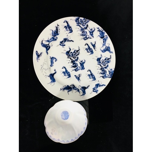 118 - A Chinese 100 horses pattern porcelain plate, decorated in blue, red seal mark verso; a Chinese egg ... 