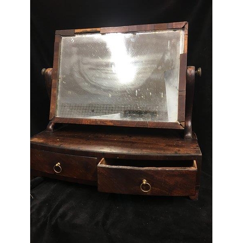 163 - A Victorian mahogany toilet mirror, the rectangular plate above two drawers with brass ring handles,... 