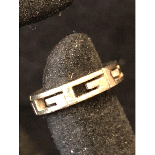 13 - Gucci - A white gold G logo unisex ring, formed as six G  openwork letters and a blank rectangle, st... 