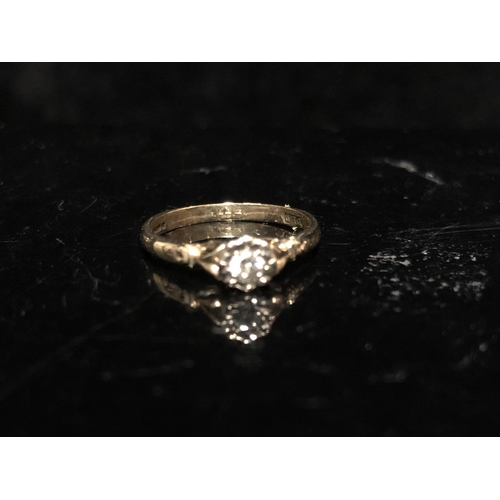 16 - Two diamond rings -An illusion set single stone diamond ring, of round brilliant cut, 2.8mm diam app... 